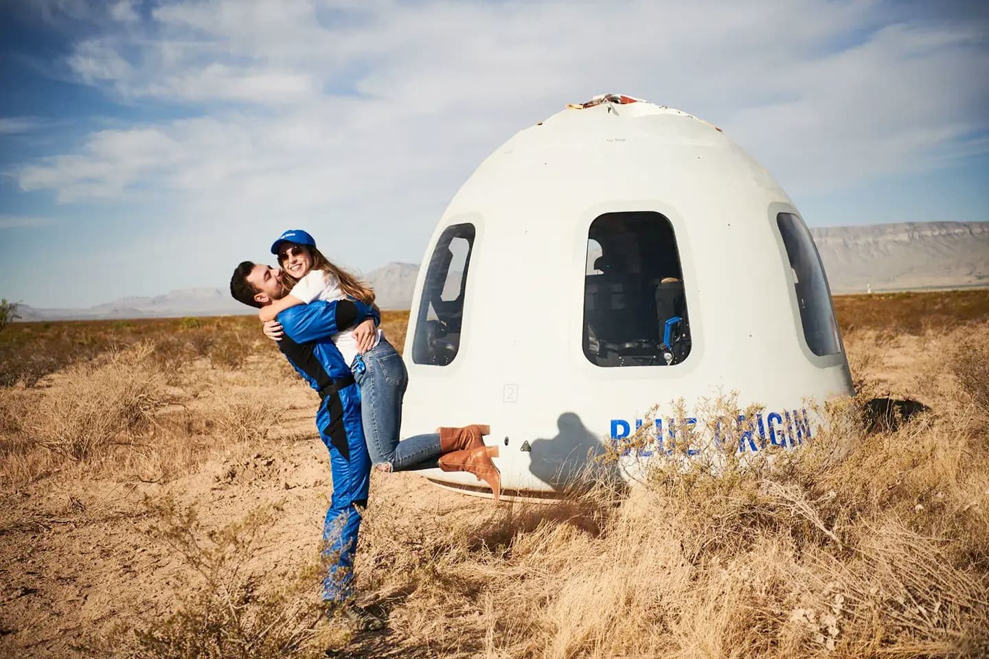 Victor is greeted by his wife Marcela upon his return from space